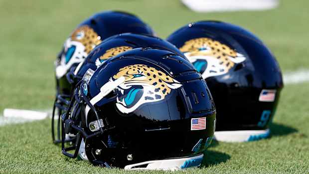 Jacksonville Jaguars helmets sitting on the field